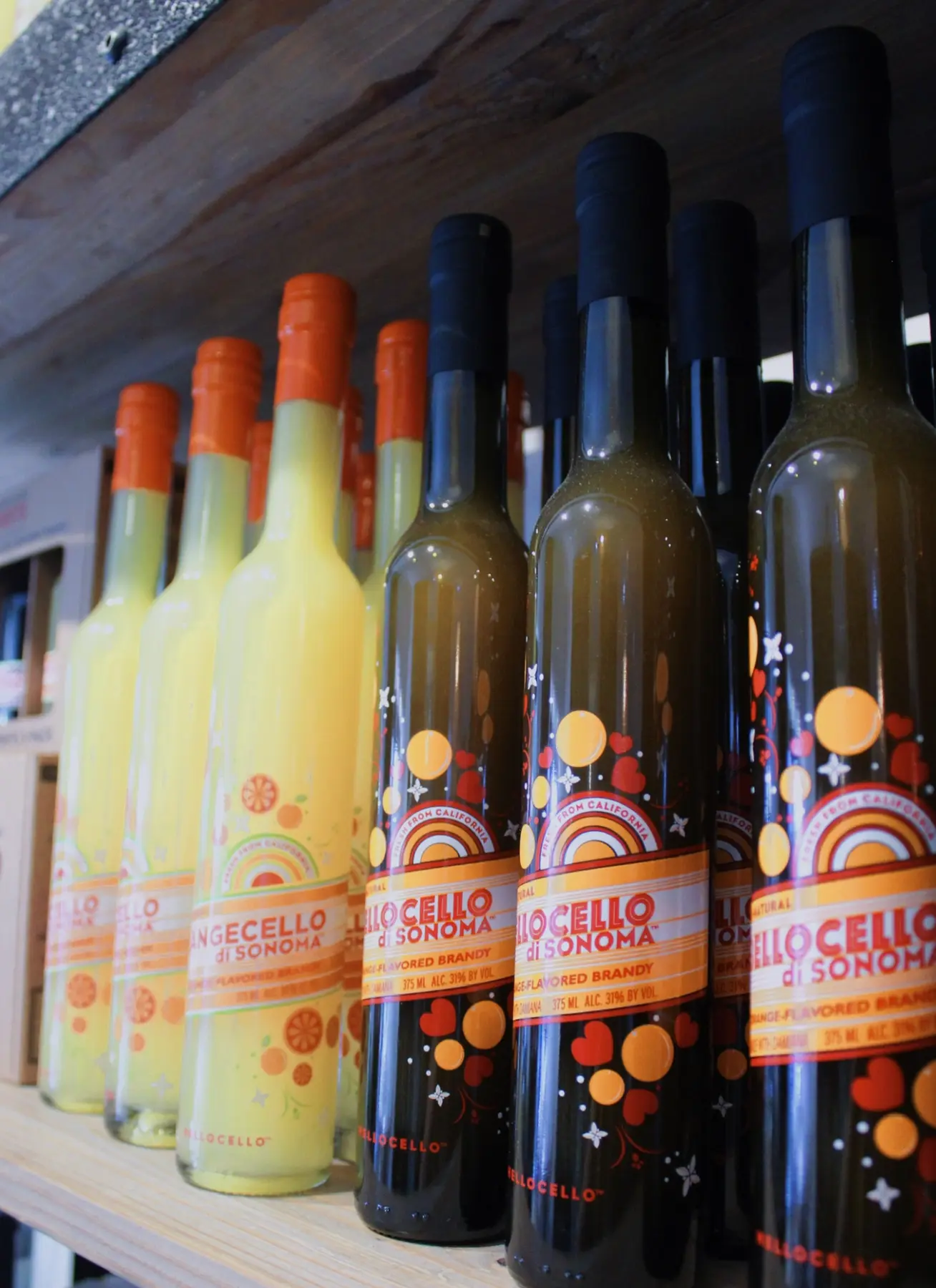 A colorful family of handcrafted Hellocello bottles