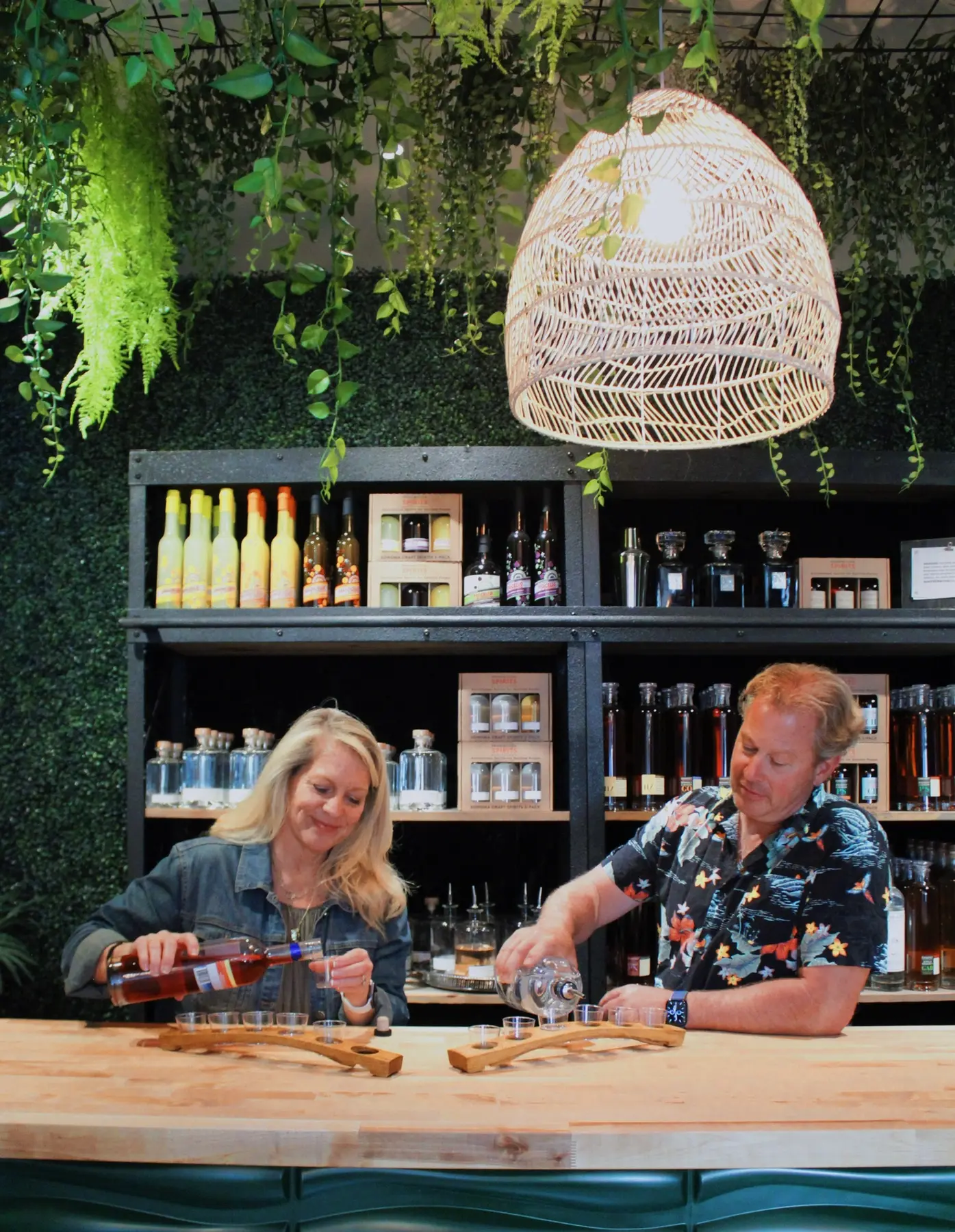 Amy and Fred Groth pouring a tasting at Prohibition Spirits