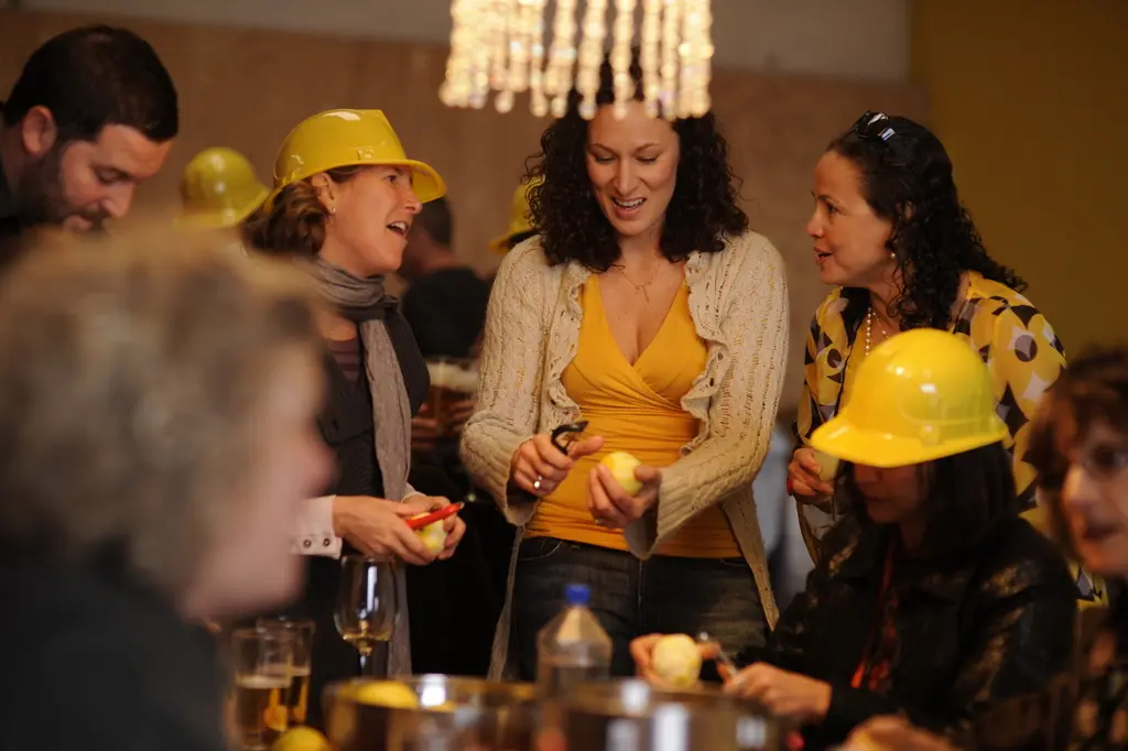 Friends peeling lemons together at an early Hellocello gathering